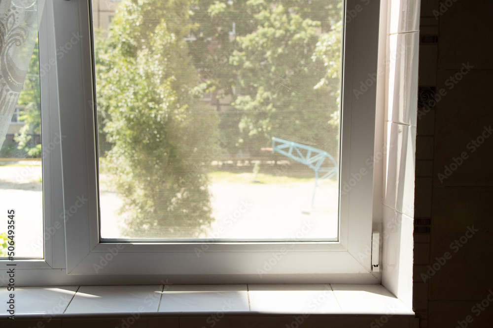 Metal-plastic window in an apartment in a residential building, window
