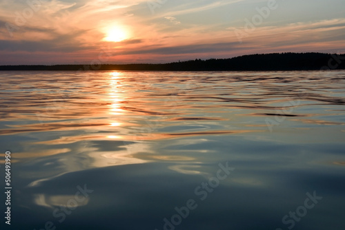 Sunset on the forest lake "Krasavitsa" at Zelenogorsk, Russia