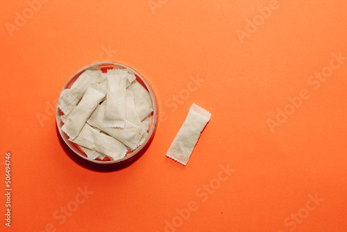 фотографія Nicotine snus spiders, tobacco pads, quit smoking concept.