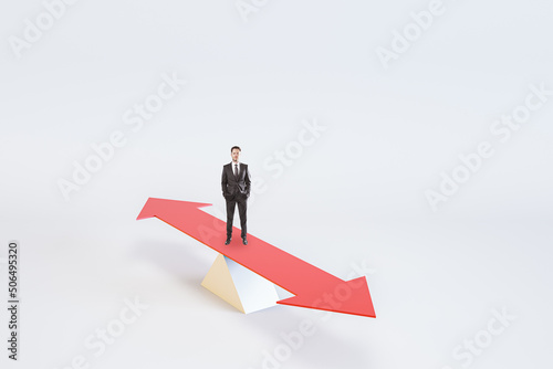 Choosing the right life concept with businessman staying on red arrow like on a swing on abstract light background