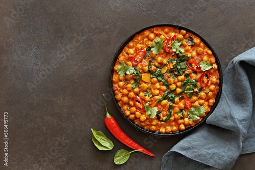 Spicy Chickpea and Spinach Curry. African chickpea stew. Flat layot