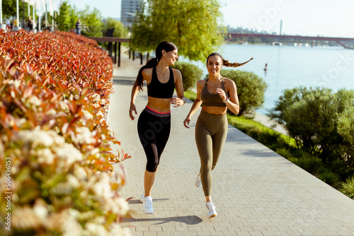 Young woman taking running ...