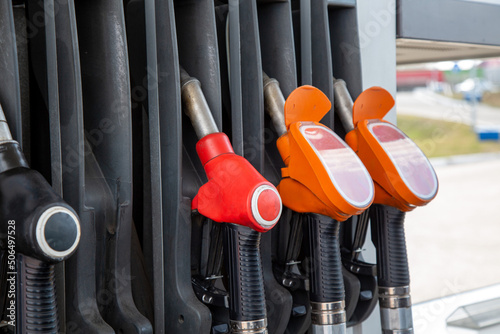 Pistols for pouring gasoline and diesel fuel at a gas station. Fuel for cars, transport.
