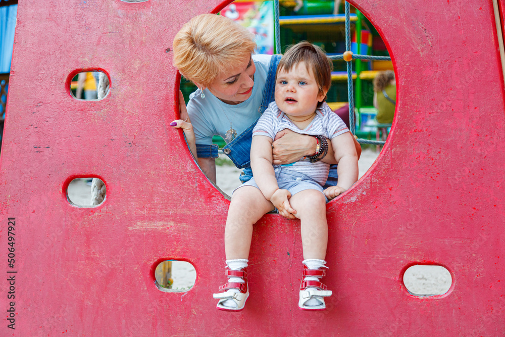 Fototapeta premium beautiful girl with children on a children's playground