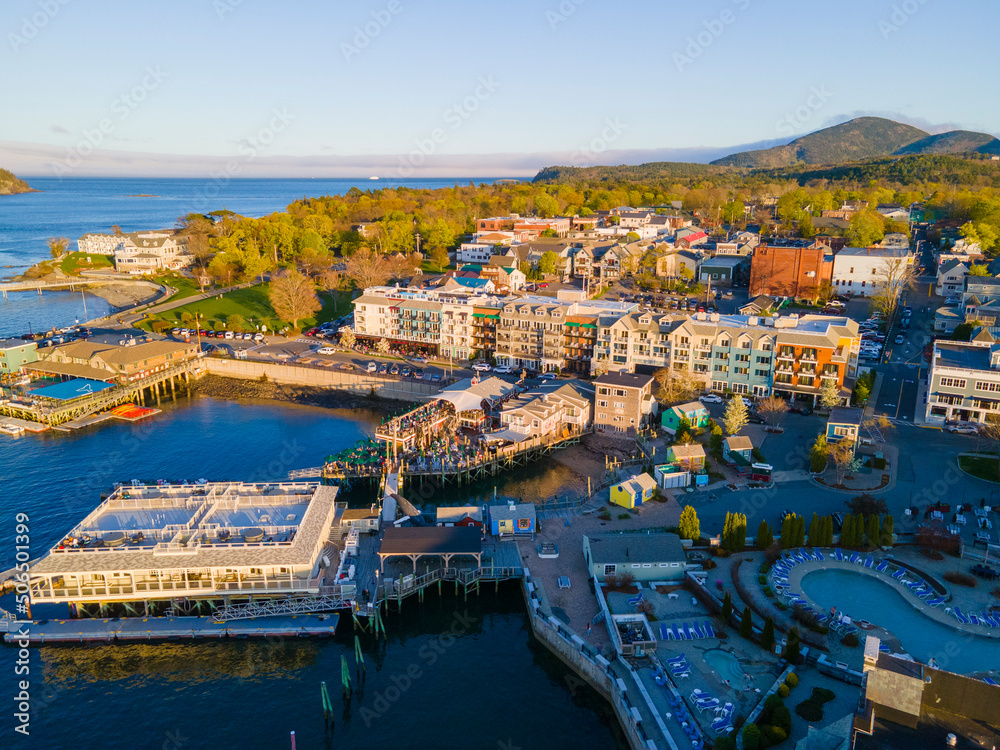 Bar Harbor historic town center aerial view at sunset, with Cadillac Mountain in Acadia National Park at the background, Bar Harbor, Maine ME, USA. 