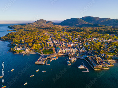 Bar Harbor historic town center aerial view at sunset, with Cadillac Mountain in Acadia National Park at the background, Bar Harbor, Maine ME, USA. 