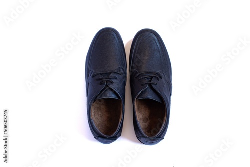 Pair of black leather men's shoes isolated on white background. Top view.