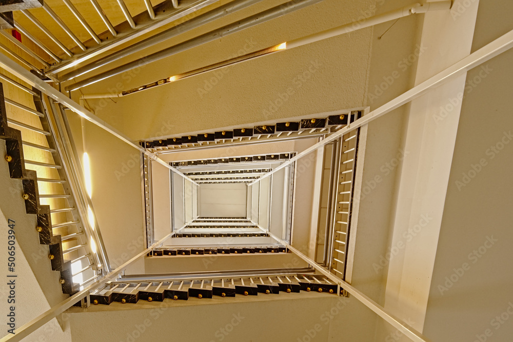 Obraz premium Rectangular staircase over seven floors in the old abandoned city library of Ghent, Belgium, seen from below