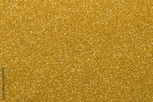 glitter with lots of bright golden color reflections which can symbolize luxury opulence wealth ideal as a background