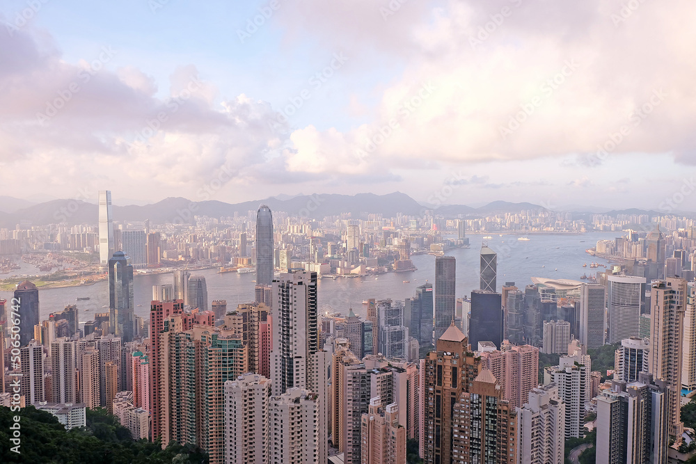 Panorama of Hong Kong business district in a foggy day. Beautiful sunset over the Victoria bay in Hong Kong.
