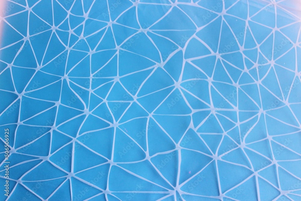 Blue background with geometric pattern. Thin white lines, cobwebs. Abstract background. Background for the cover of a notebook, laptop. Blue background with geometric pattern. Thin white lines, cobwebs. Abstract background. Background for the cover of a notebook, laptop.