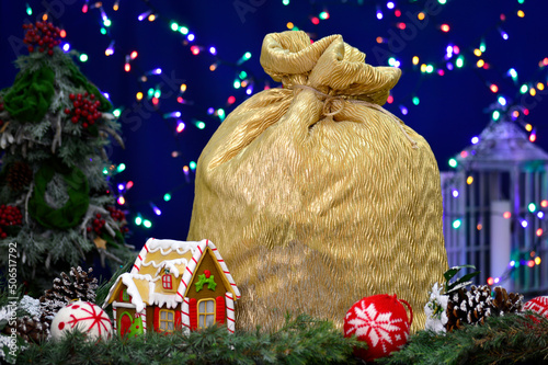 Christmas gingerbread house installation with big bag for gifts