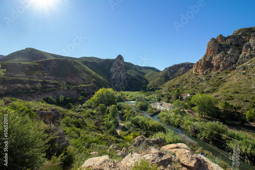 Landscape with green mountains and a small river in Spain.  Town of Gestalgar/Valencia.