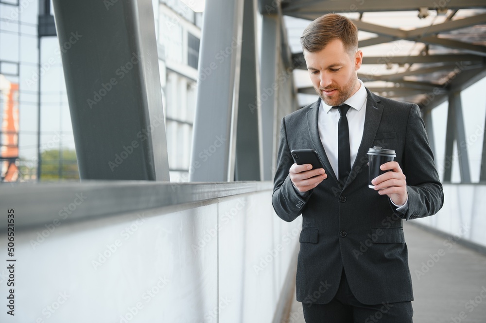 Portrait of an handsome businessman in an urban setting