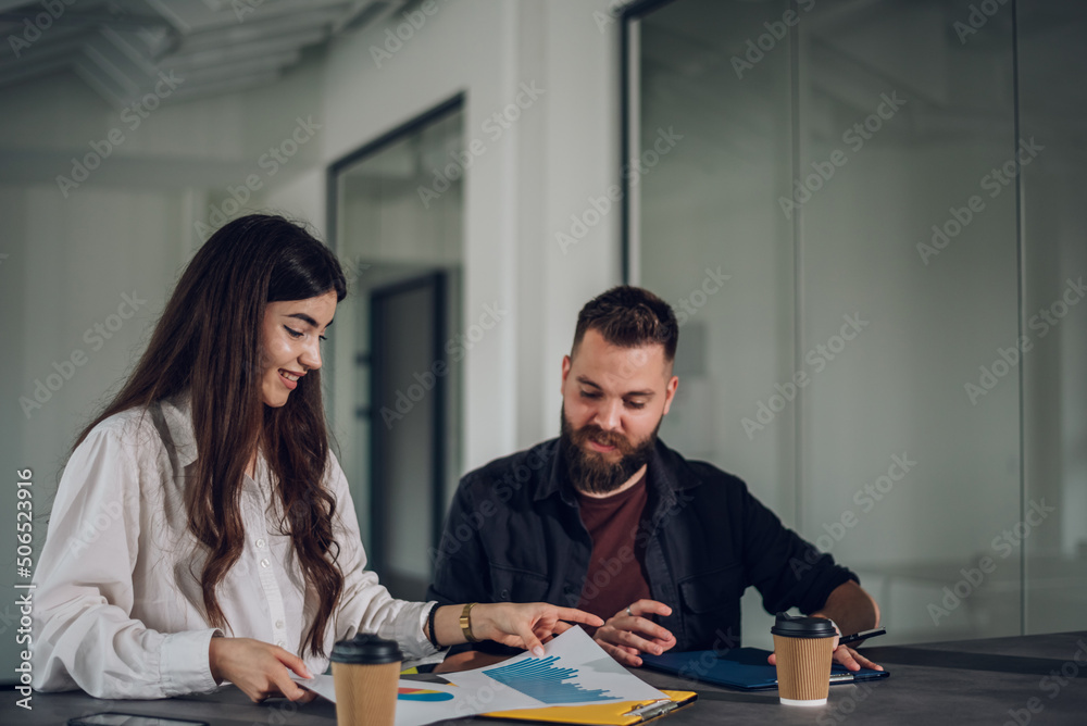 Two business colleagues having a meeting in the open space office