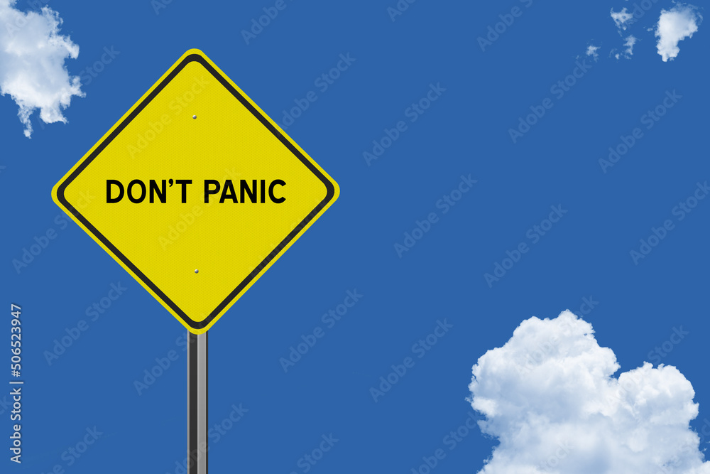 Don't Panic sign on sky background. Don't Panic sign on sky background.