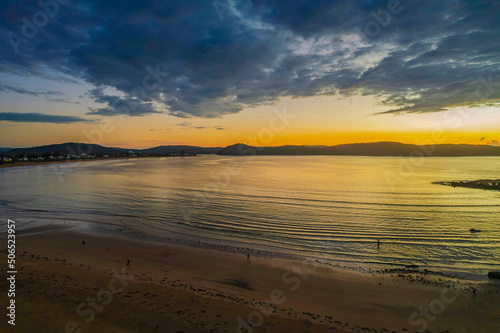 Aerial sunrise seascape with  low clouds