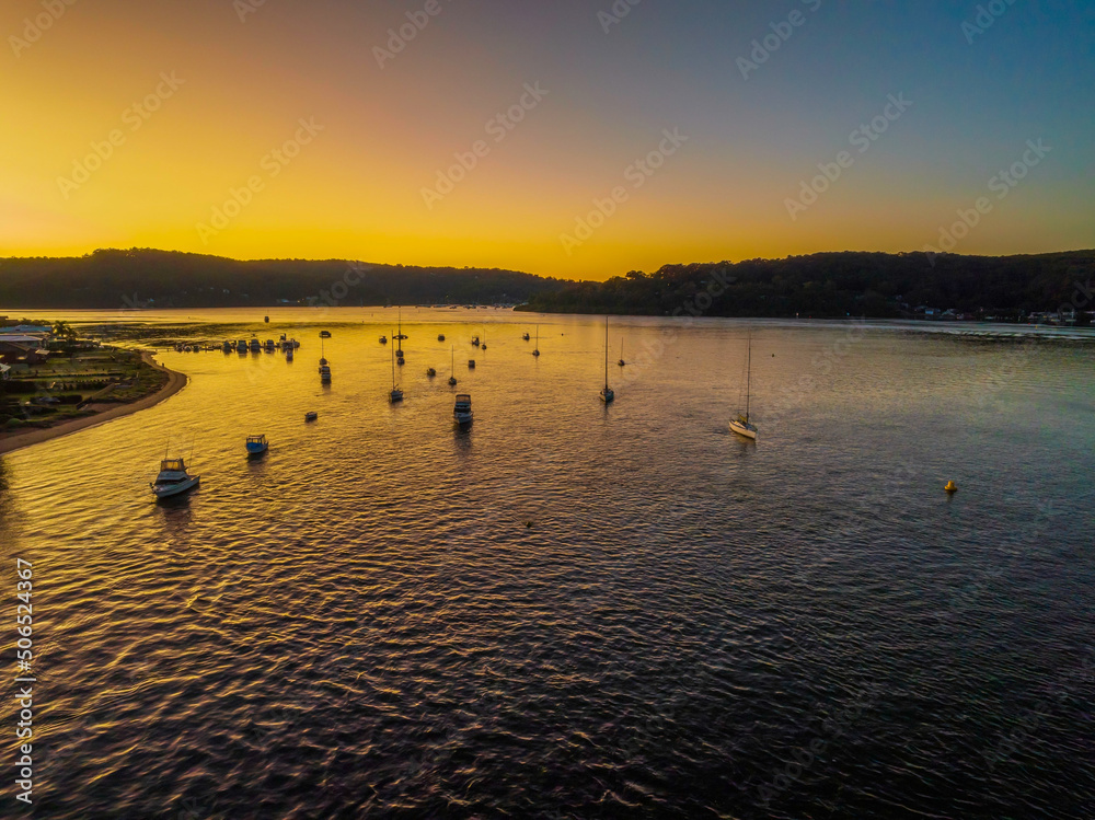 Fototapeta premium Aerial sunrise waterscape with clear skies