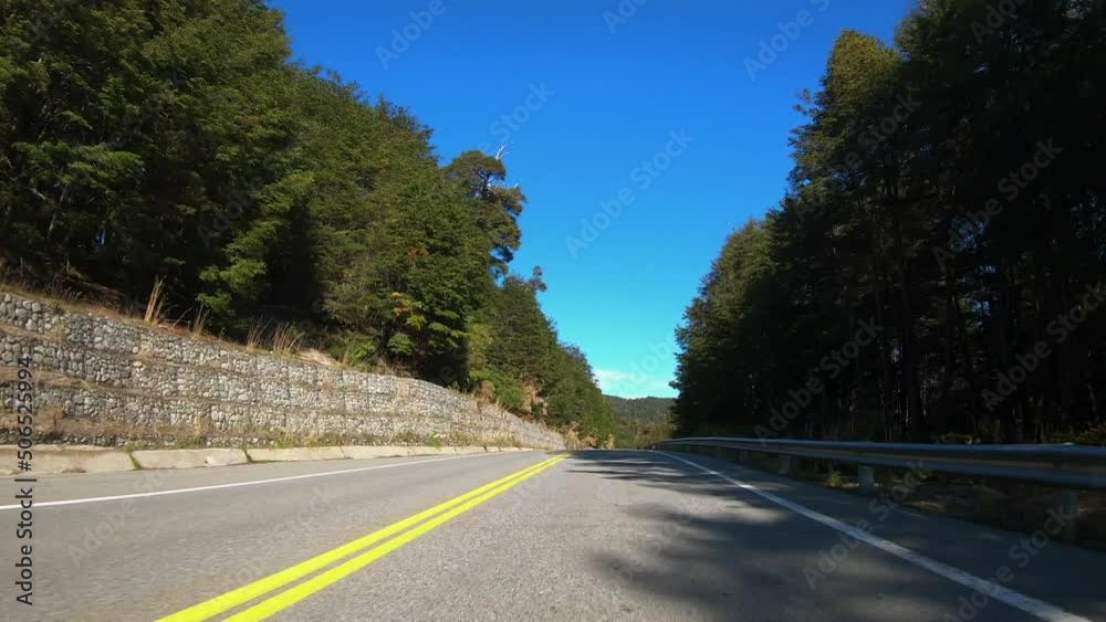 Tourism. Point of view of a car driving along the asphalt road across the forest and mountains in autumn. Tourism. Point of view of a car driving along the asphalt road across the forest and mountains in autumn.