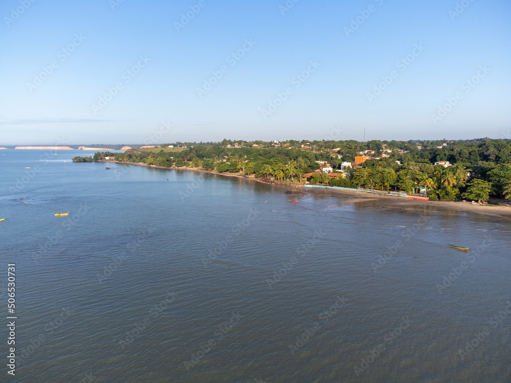 Charming seaside town with the look of a fishing village in the middle of the Atlantic Forest - Cumuruxatiba, Bahia, Brazil - aerial drone view of the beach