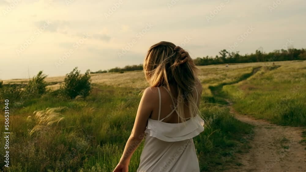 The girl walks through the natural forest. A woman enjoys the sunset. A woman in nature. The imagination of people in the park in the fall. Active lifestyle. People in the woods. Tourist walk through The girl walks through the natural forest. A woman enjoys the sunset. A woman in nature. The imagination of people in the park in the fall. Active lifestyle. People in the woods. Tourist walk through