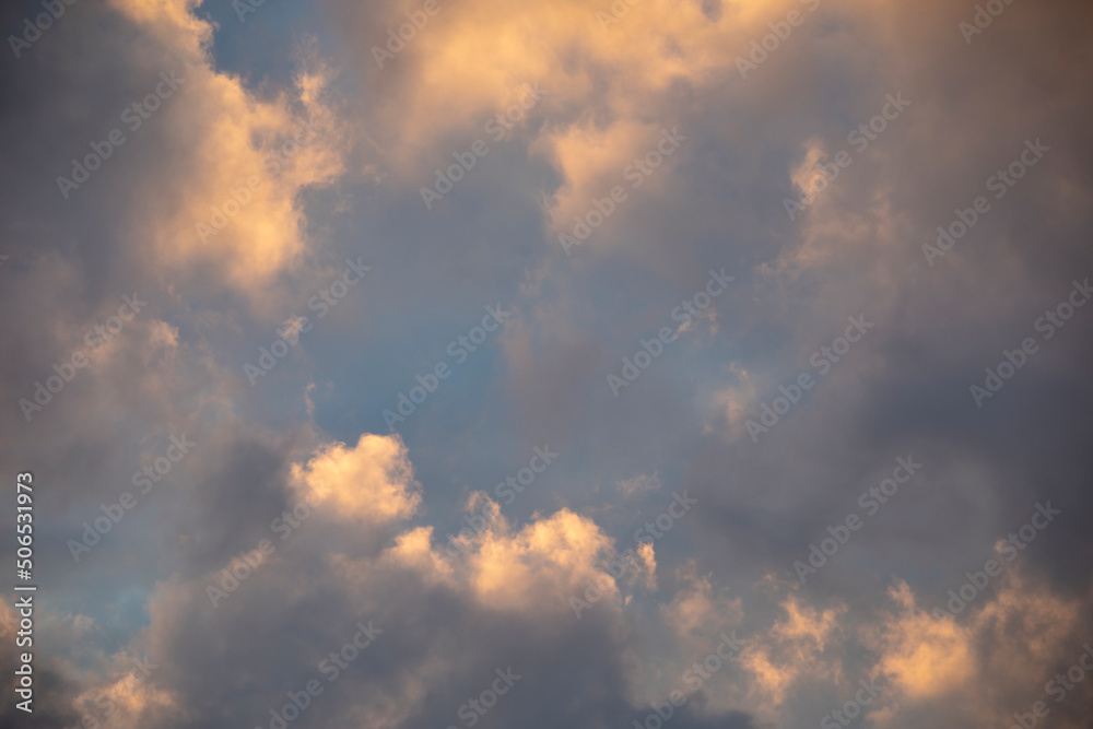 Dark sky background with white dramatic clouds and sunlight, sky background