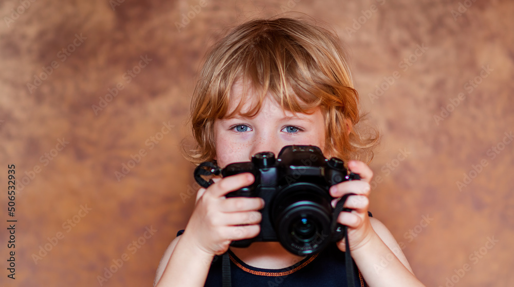 Portrait of Young blond caucasian schoolchild with DSLR Camera Portrait of Young blond caucasian schoolchild with DSLR Camera