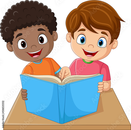 Happy little children reading a book