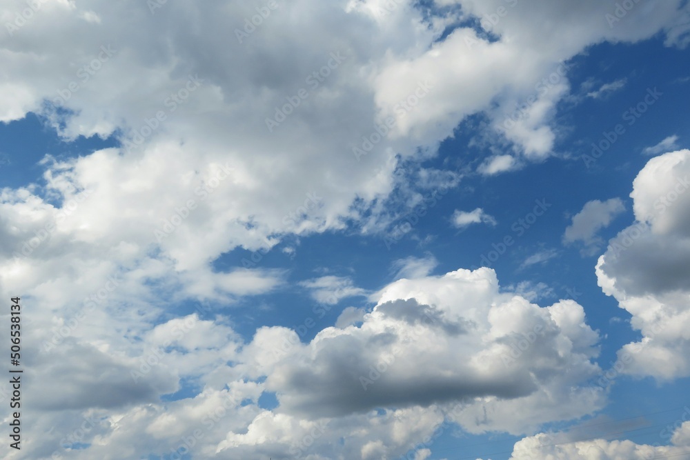 Beautiful white fluffy clouds in blue sky background Beautiful white fluffy clouds in blue sky background