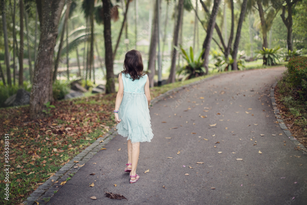 child walking in the park child walking in the park