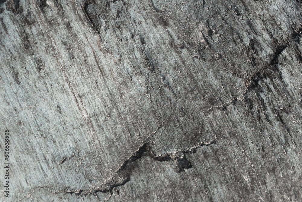 Slate stone wall as background. Textured surface of geological layer of soil Slate stone wall as background. Textured surface of geological layer of soil