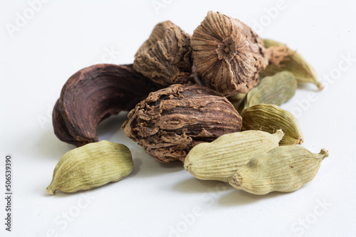 Black and green cardamom pods, a popular spice in traditional Indian cuisine and also in many other cultures