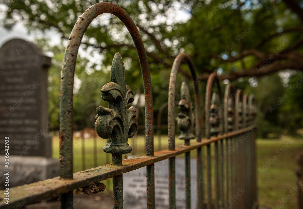 wrought iron fence around the grave in a historic cemetery Stock Photo