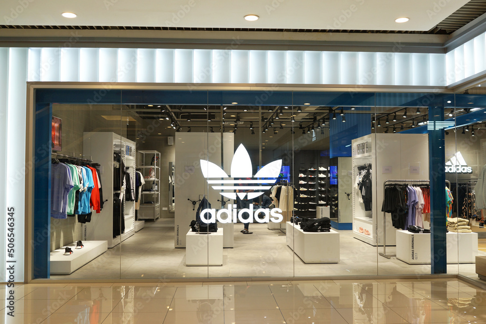 PENANG, MALAYSIA - 20 MAY 2022: Modern interior view of Adidas store in Mall, Penang. Adidas is a German corporation that designs and manufactures shoes, clothing and accessories. Stock Photo | Adobe Stock