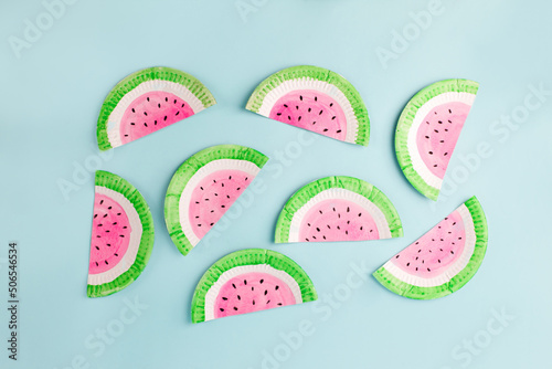 Obraz na płótnie Fruit made of paper - watermelon. Blue background. Tropics creative concept, kindergarten, daycare handmade papercraft, summer season, sweet food. Flat lay. w salonie