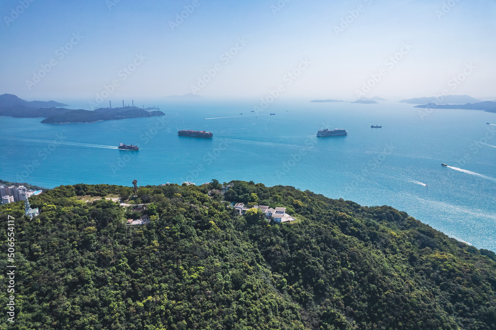 cargo container ship sailing across the south of Hong Kong