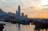 Hong Kong island, the view of typhoon shelter with old fashioned boat and new modern skyscraper