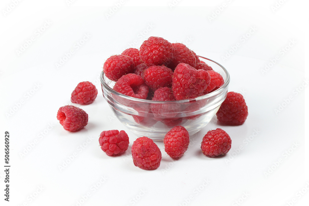 raspberries in a glass bowl isolated on a white background raspberries in a glass bowl isolated on a white background