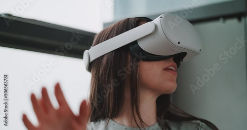 Close up of young woman smiling while experiencing virtual reality
