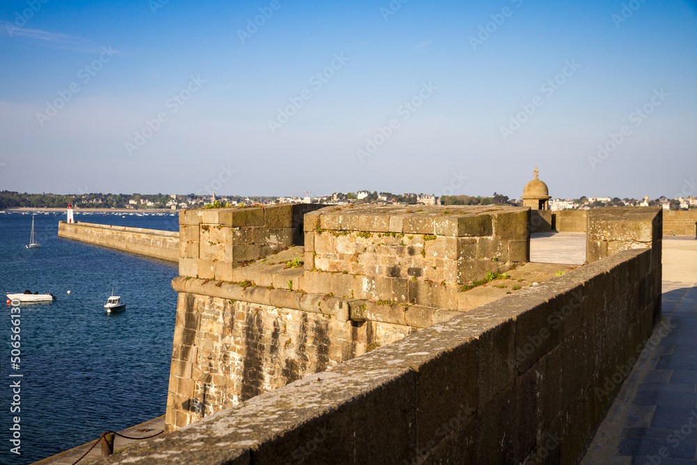 Saint-Malo lighthouse and pier view from the city fortifications, Brittany, France