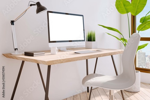 Close up of creative designer desktop with empty white mock up computer screen, in interior with panoramic city view, daylight, furniture and decorative plant. 3D Rendering.