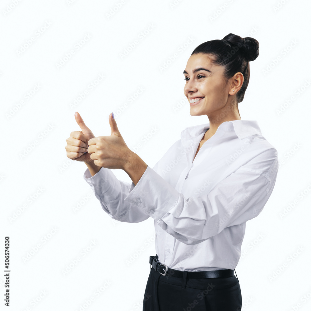 Like concept with happy young woman in white shirt holding thumbs up on white background, close up, isolated Like concept with happy young woman in white shirt holding thumbs up on white background, close up, isolated