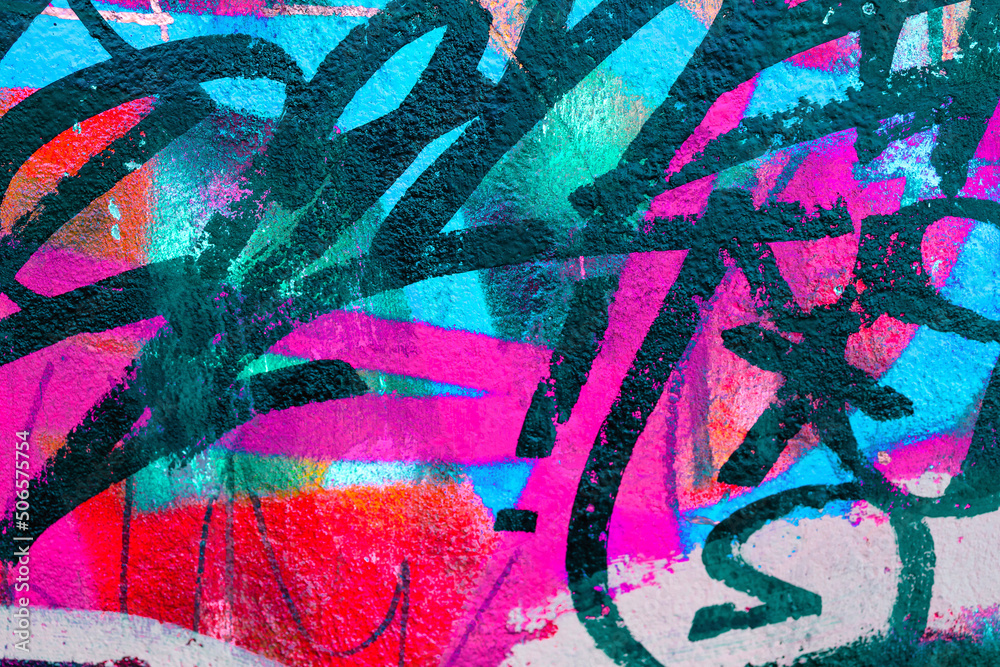 Fototapeta premium Colorful teal, pink, blue and black urban wall texture. Modern pattern for wallpaper design Creative modern urban city background for advertising mockups. Grunge messy street style new wave background