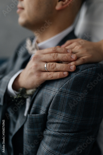 close up of a man holding his hands