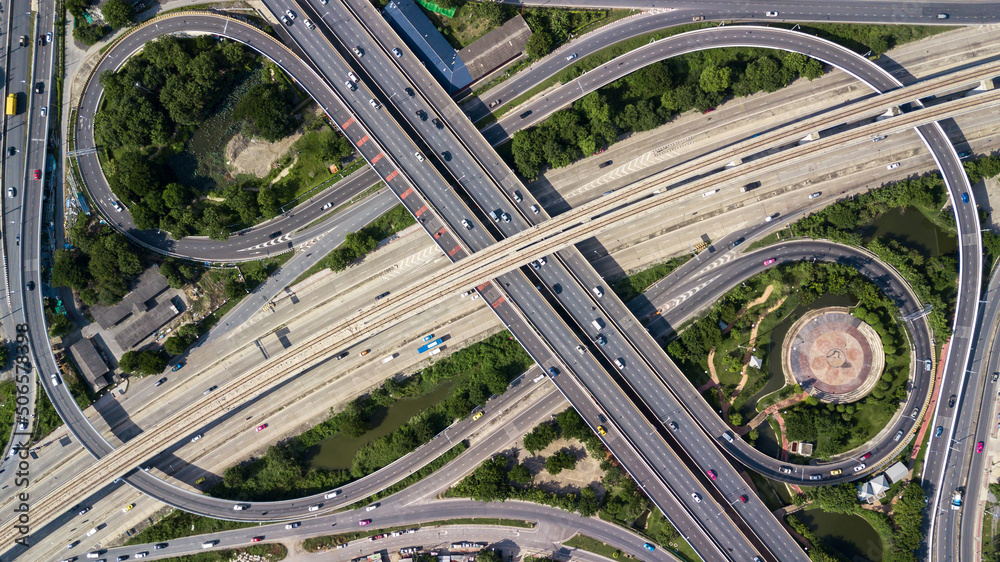 Aerial top view road traffic interchange in city, Aerial view of highway and overpass in city, Expressway top view, Road traffic an important infrastructure, Ecology. Aerial top view road traffic interchange in city, Aerial view of highway and overpass in city, Expressway top view, Road traffic an important infrastructure, Ecology.