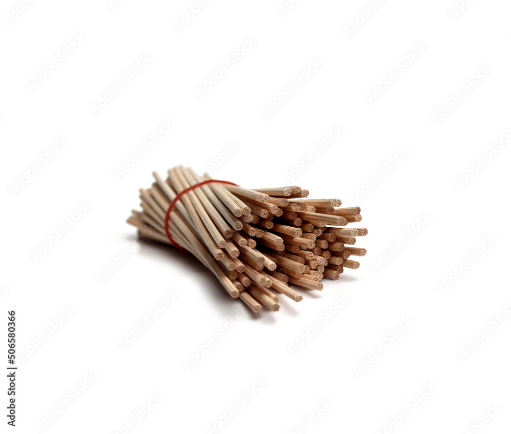 Obraz premium Several pieces of rattan sticks are placed on a white background.