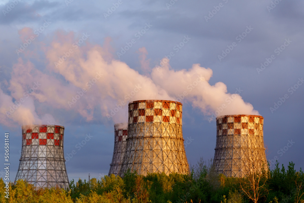 Factory pipes thermal power plants with thick white smoke from heat energy nuclear plant polluting environment