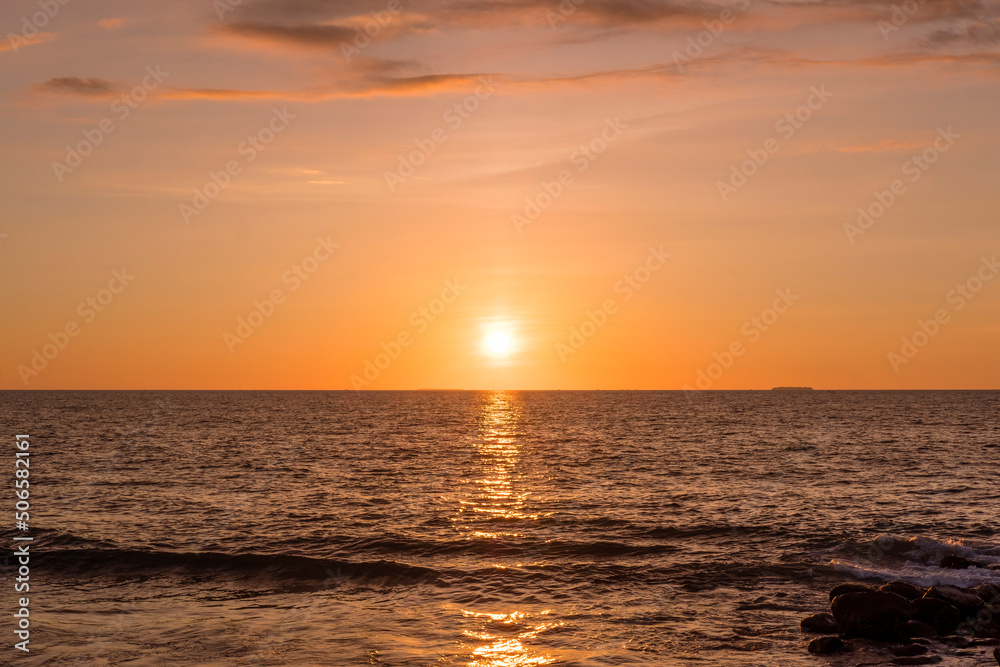 The beautiful sunset over the horizon at Taplau Beach, Padang