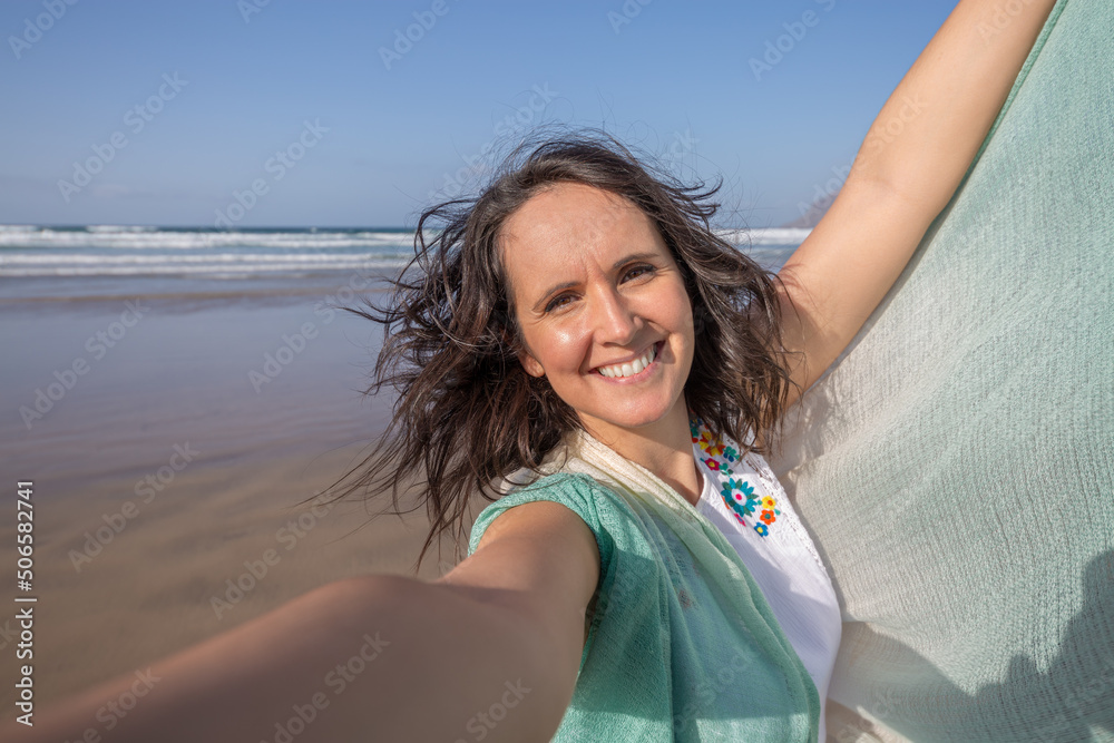 Woman taking selfie near sea
