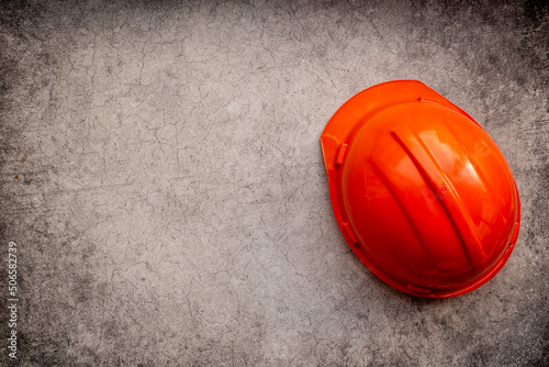 Engineer safety helmet overhead view. Construction background